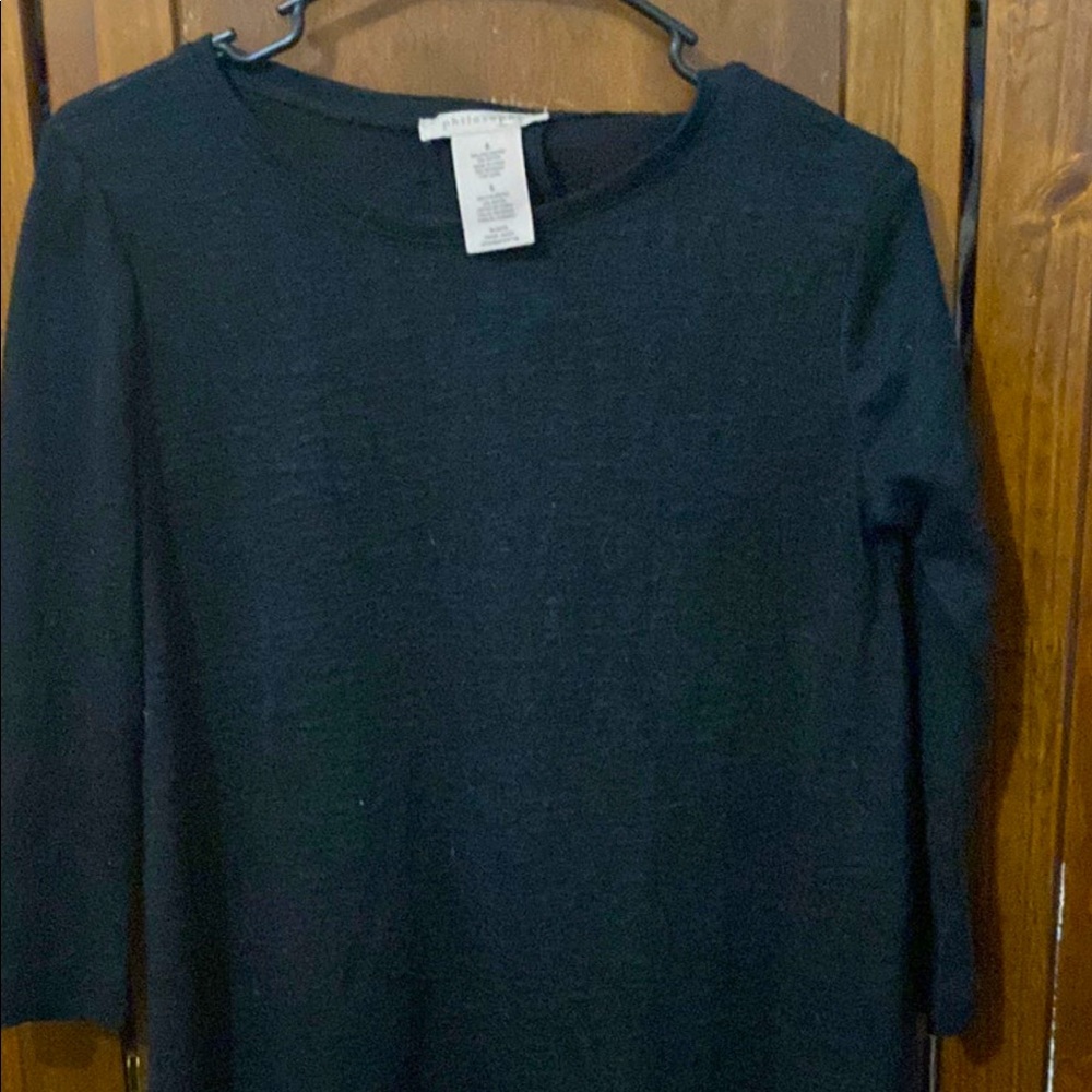 Womens black mid sleeve shirt with shoulders showing.
